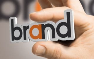 A pin that says "Brand"