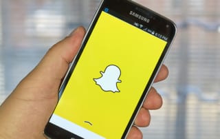 The Snapchat logo on a smartphone