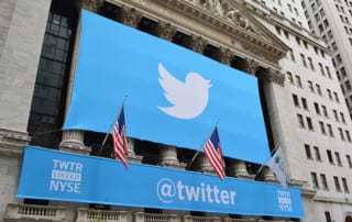 The Twitter logo, on a banner over the New York Stock Exchange