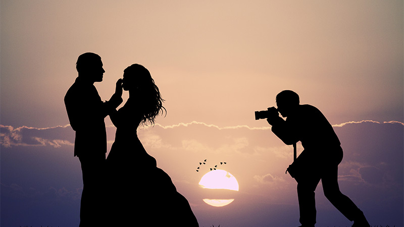 A wedding photograph, backlit by the sun