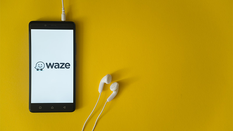 The Waze logo on a smartphone screen