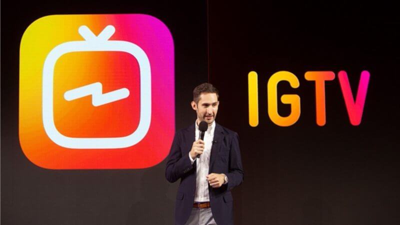 Kevin Systrom in front of the Instagram Television Logo